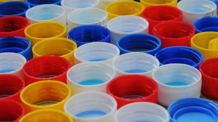 Moulded plastic caps and closures in assorted colours