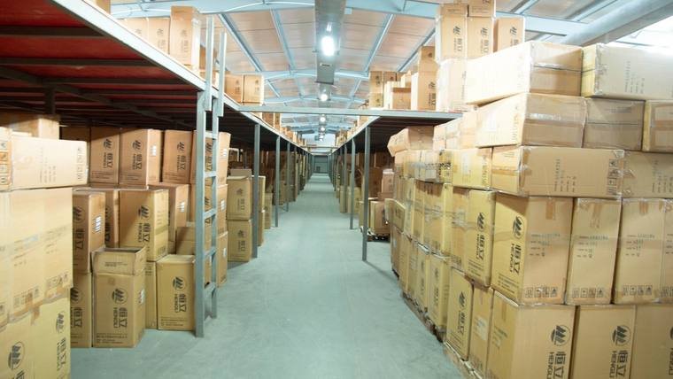 Warehouse aisle of packed goods ready for dispatch