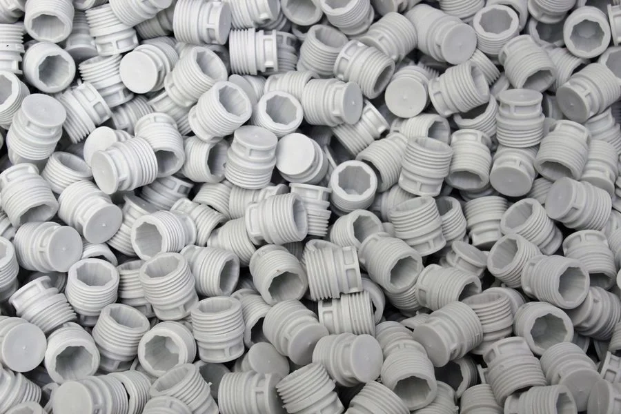 Moulded plastic caps and closures in assorted colours