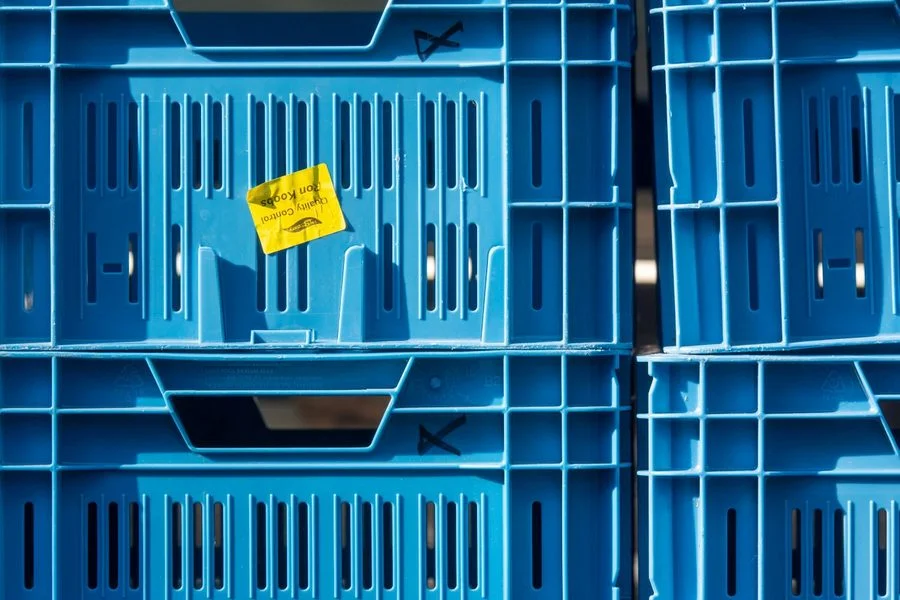 Colourful moulded plastic crates and containers